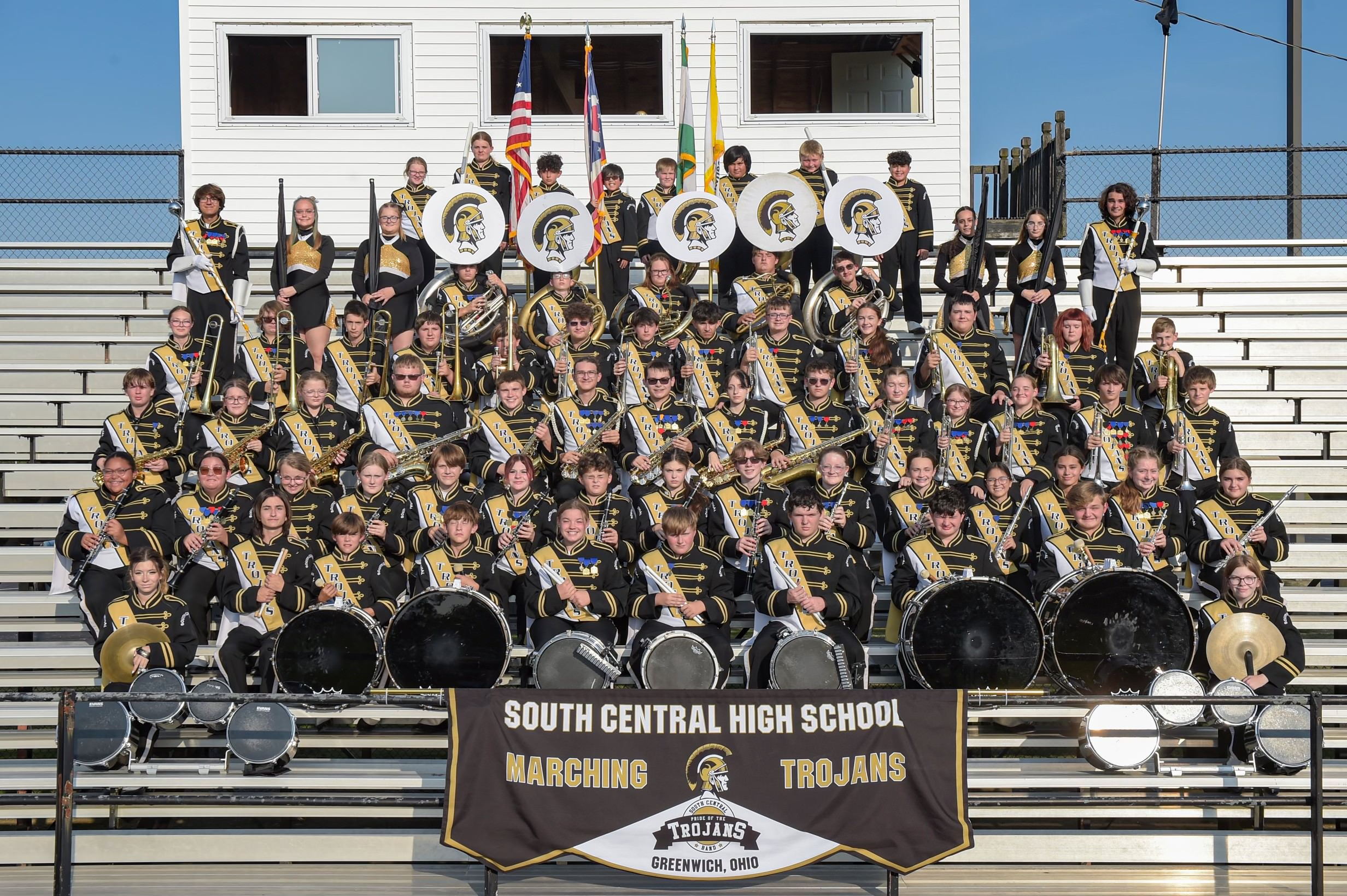 Band students on the bleachers outside