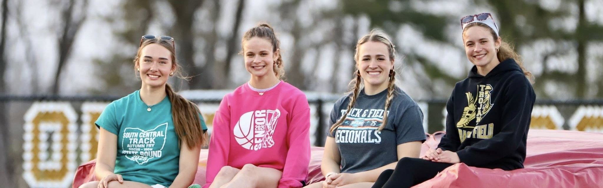 track team sitting on airbag