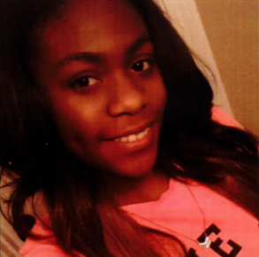 picture of a missing girl smiling with a pink shirt on