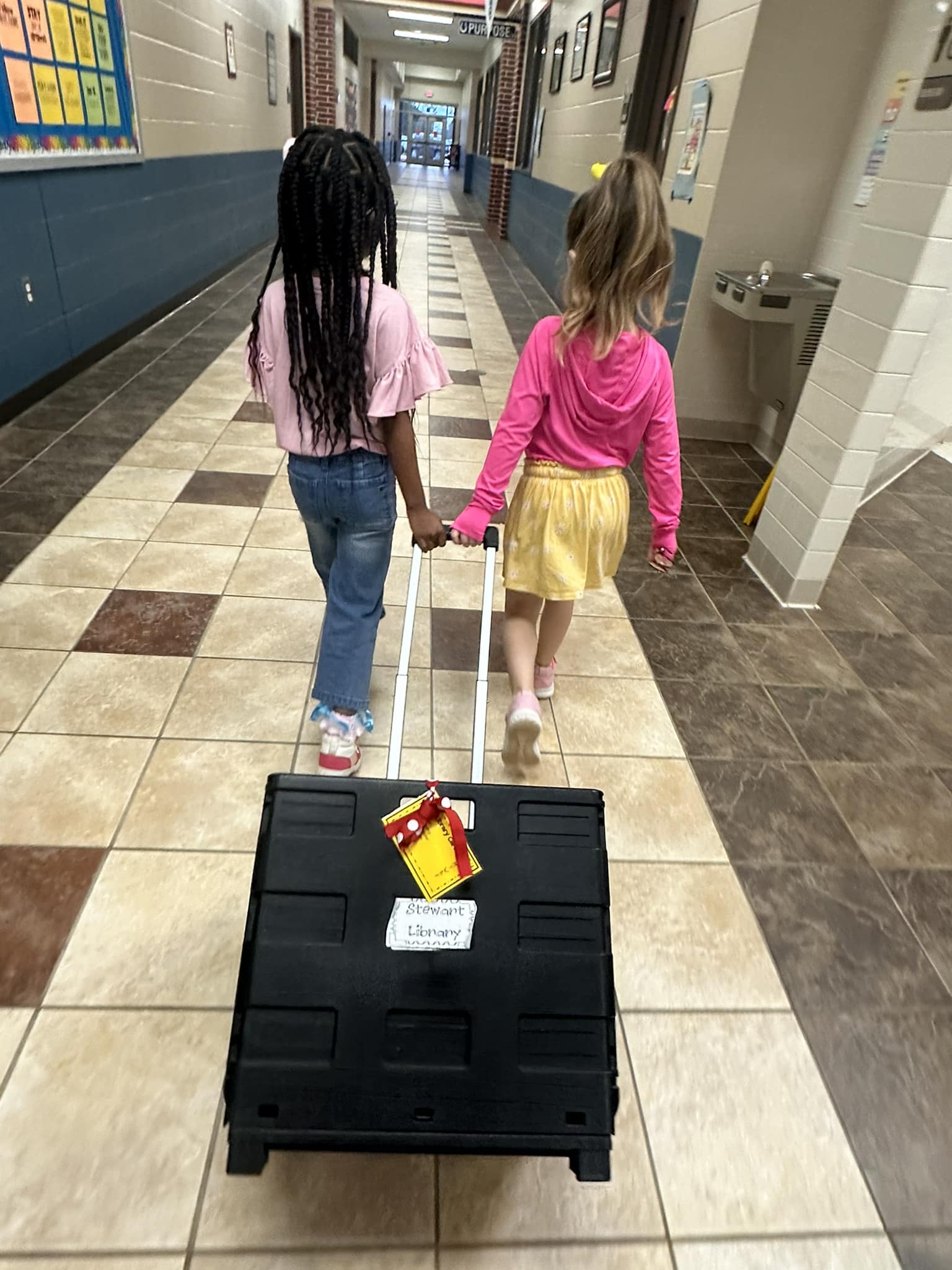 Students returning library books