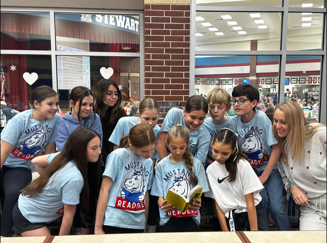 Students participating in a reading club sponsored by our librarian.