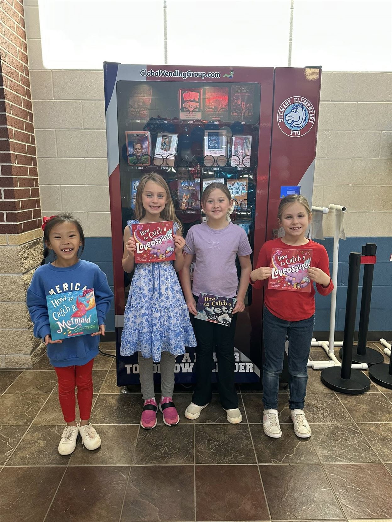 Students who just purchased a book from the vending machine.