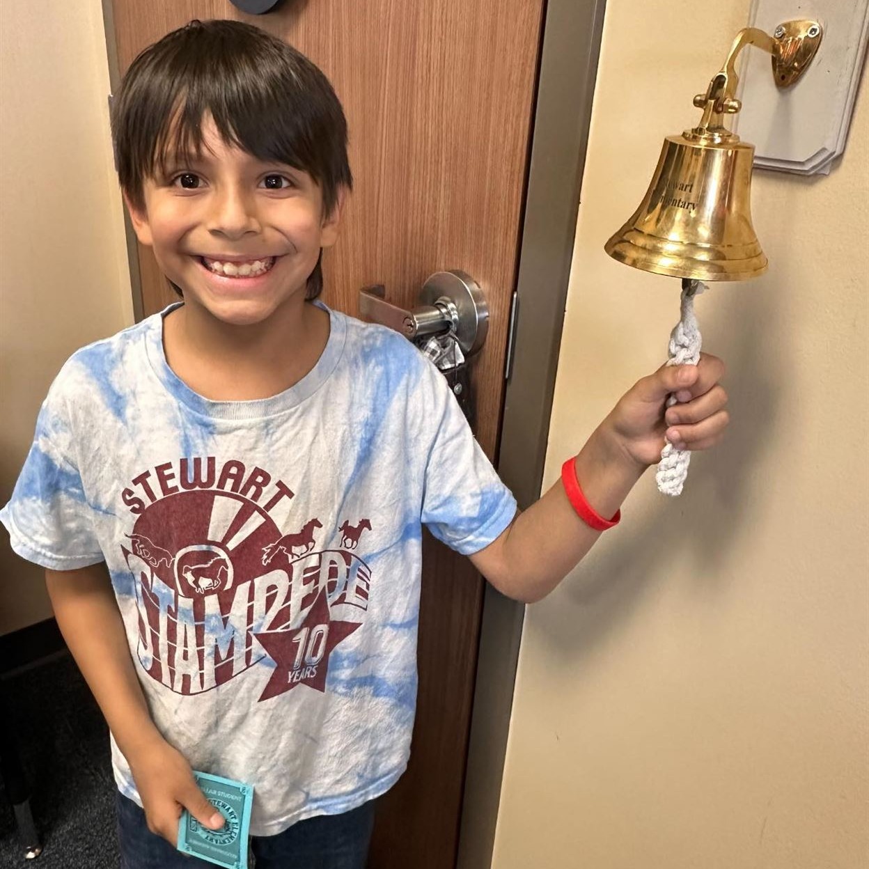 Bell Ringer celebrating Success