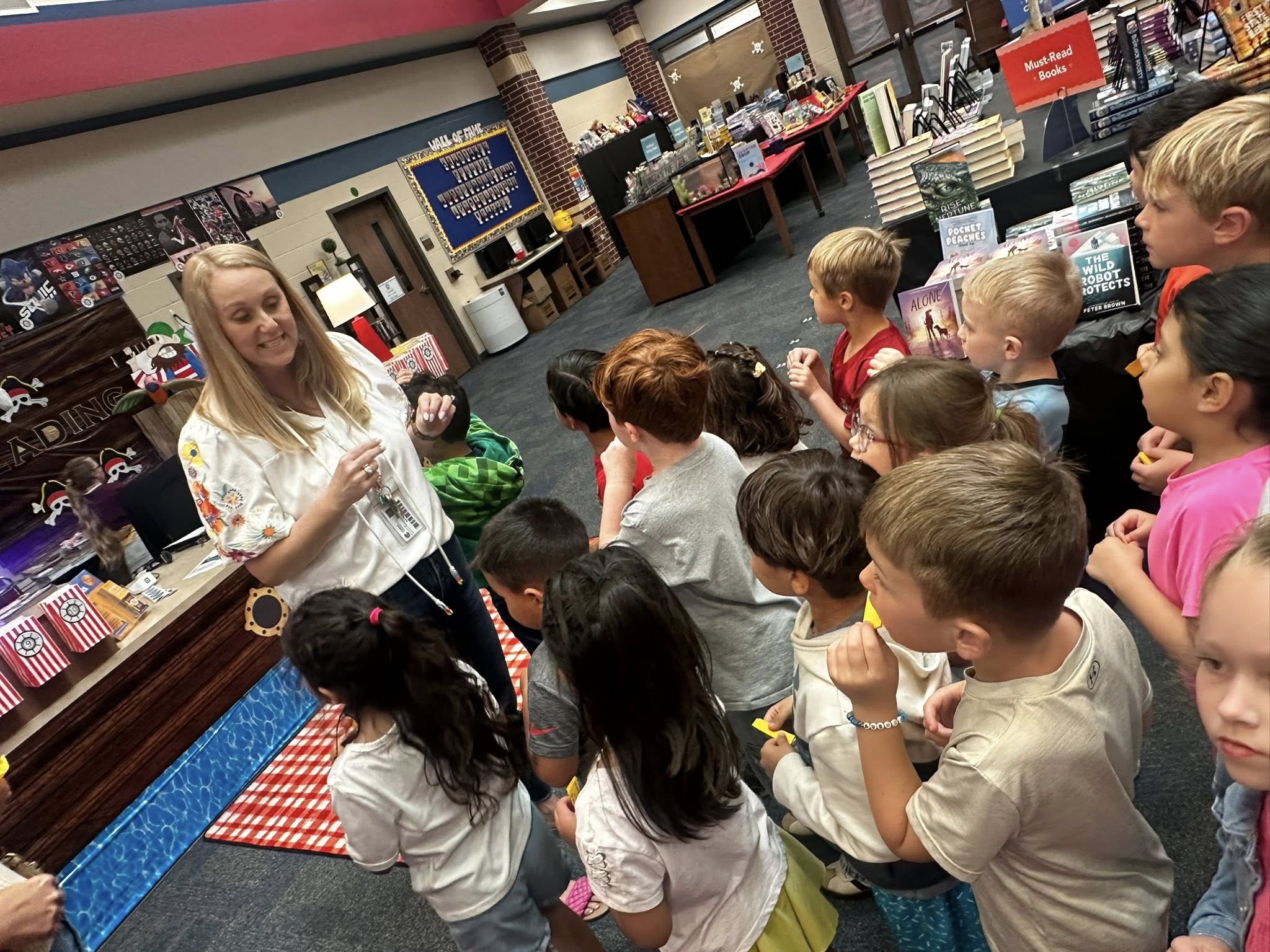Mrs. Shafer giving students instructions at the book fair