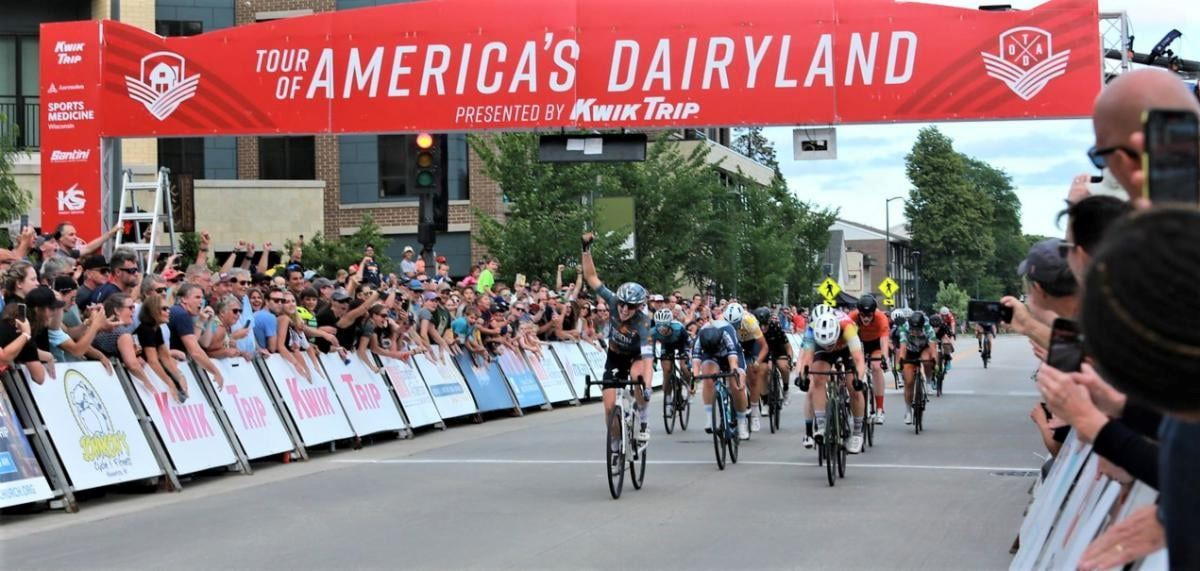 A vibrant bike race through America's Dairyland, showcasing scenic landscapes and enthusiastic participants on their journey.