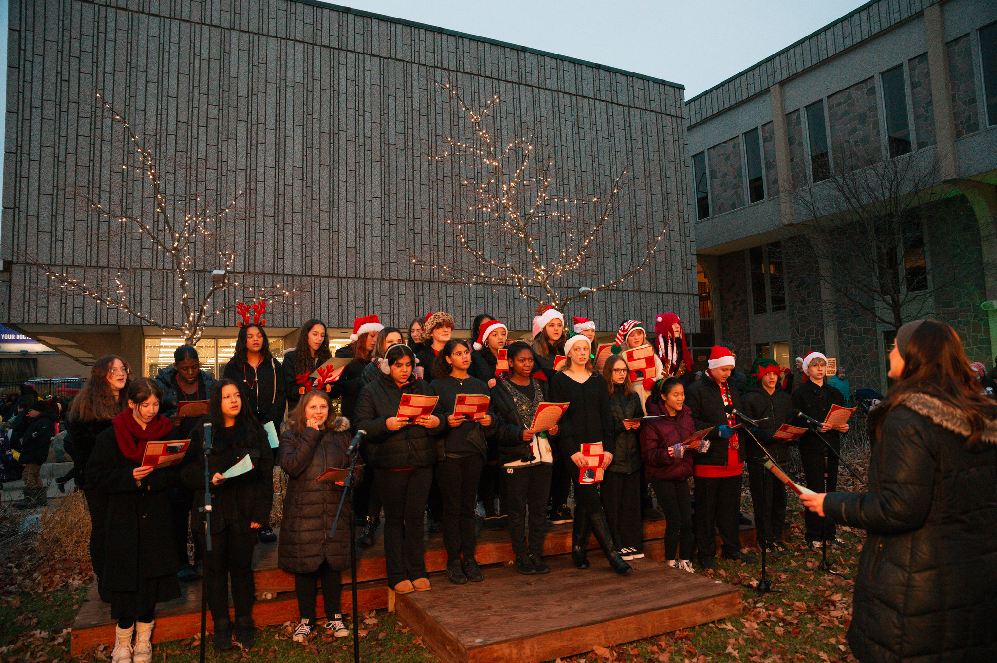 A choir performs at Centennial Plaza at City Hall