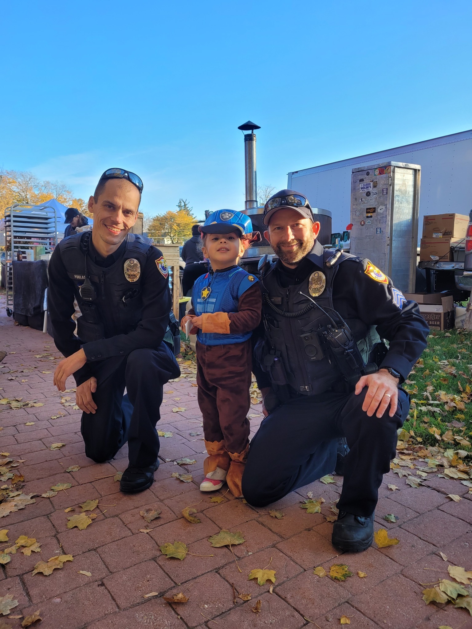 West Allis Police Officers pose with a young fan
