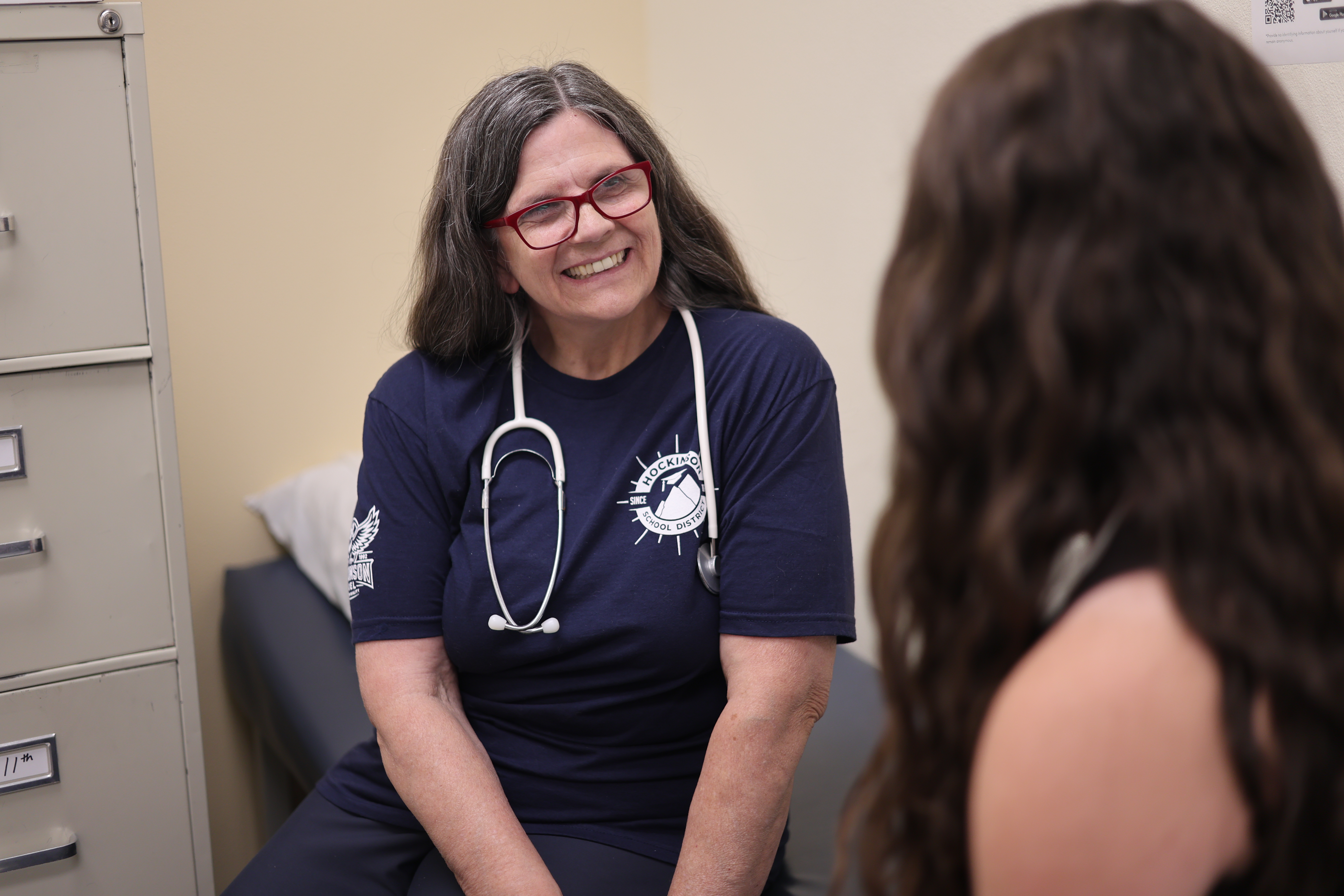 Nurse speaking with a student
