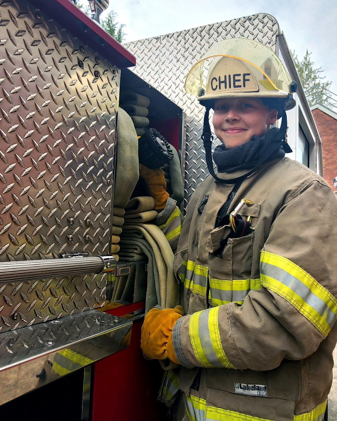 Student wearing fire fighting outfit