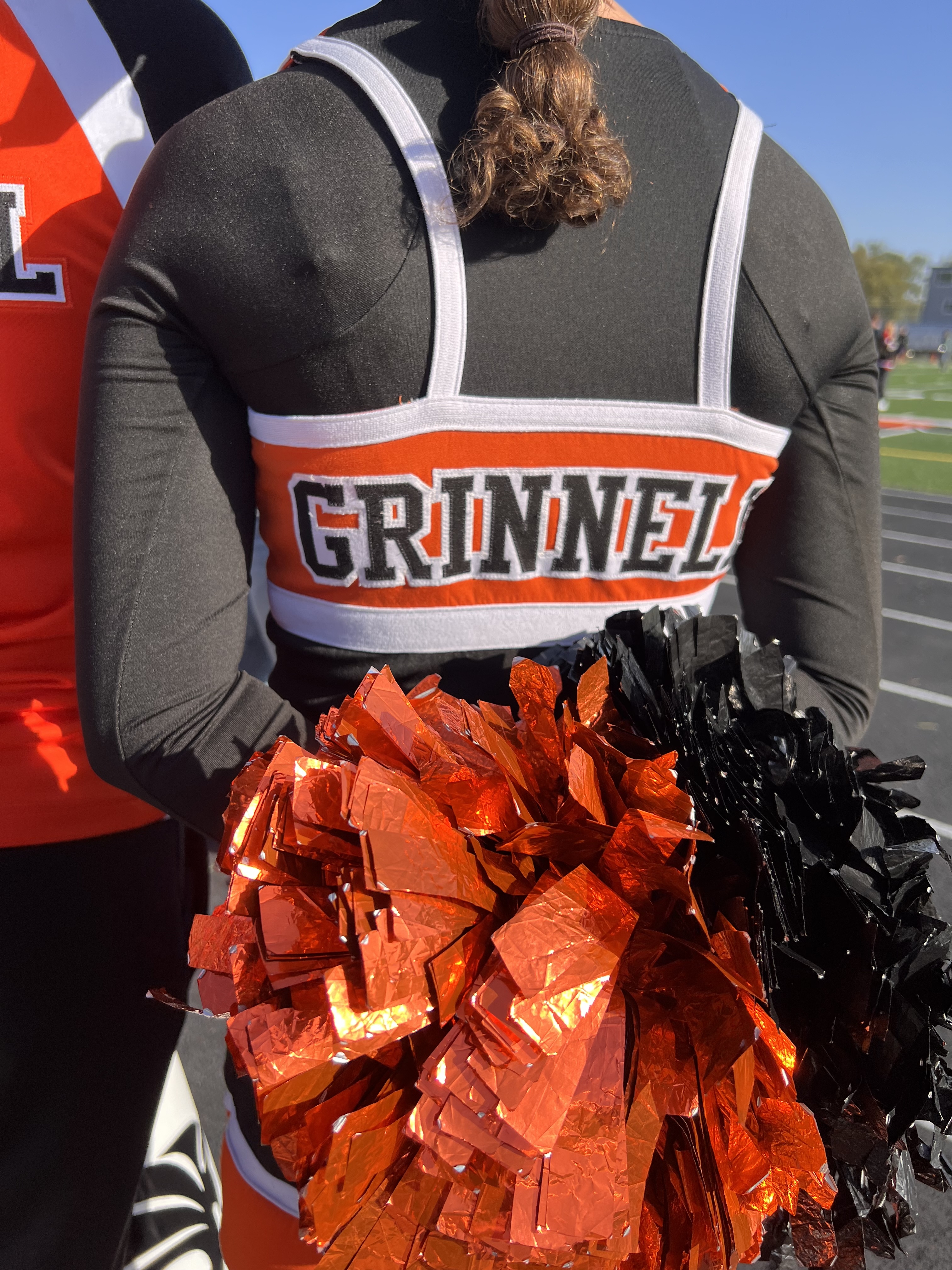 Back of cheerleader uniform. Grinnell and pompoms. 