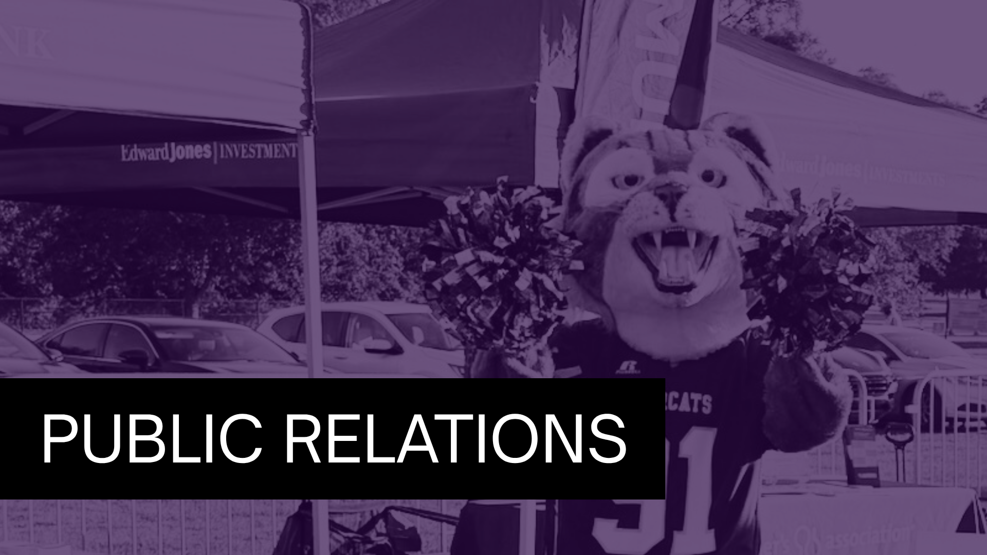 Purple-tinted image of a Bearcat mascot holding pom-poms at an outdoor event with a bold black banner reading “PUBLIC RELATIONS” across the bottom left.