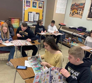 A group of students sitting at desks in a classroom