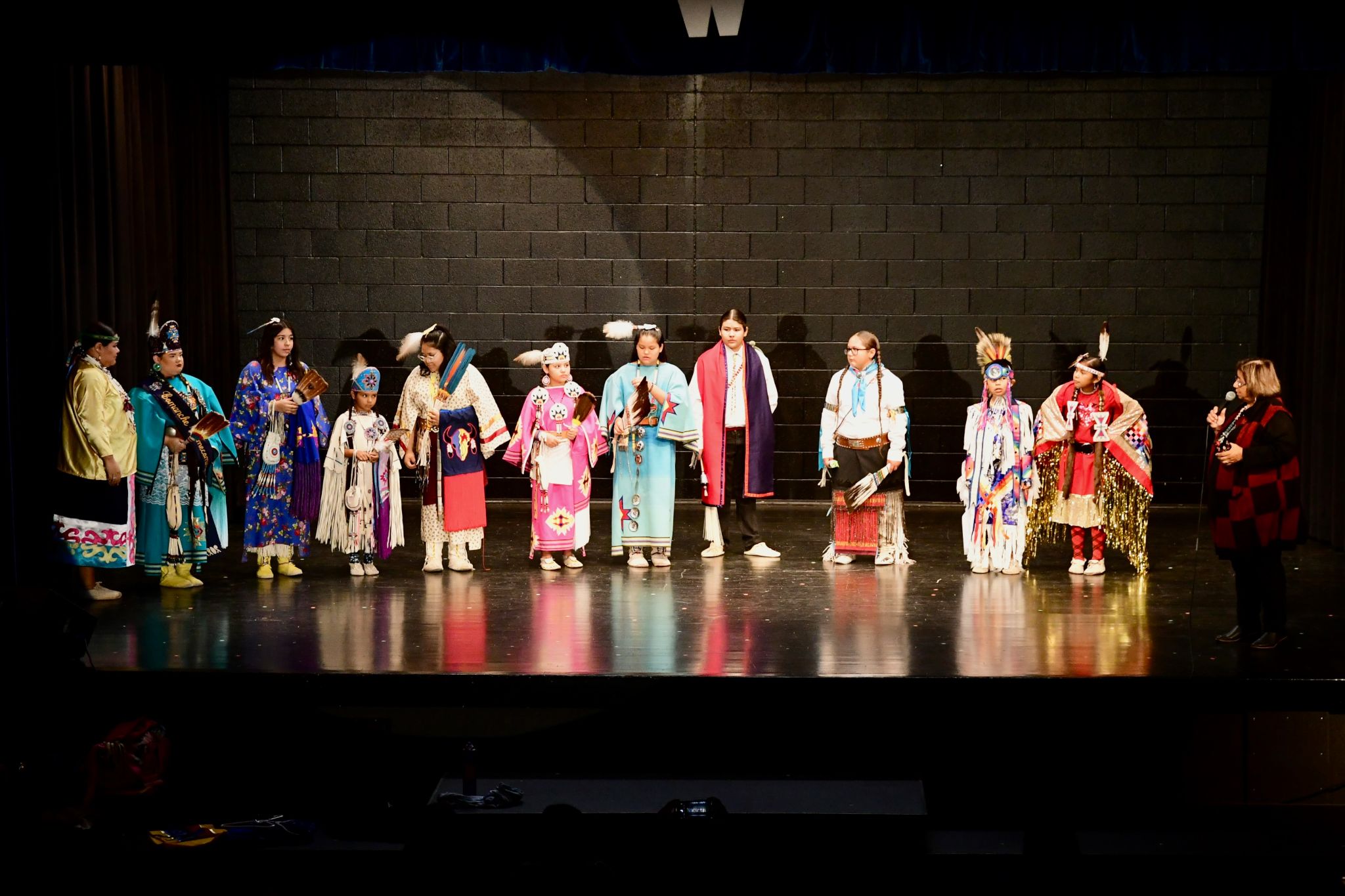 A group of people standing on top of a stage