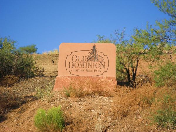 Old Dominion sign on hillside.