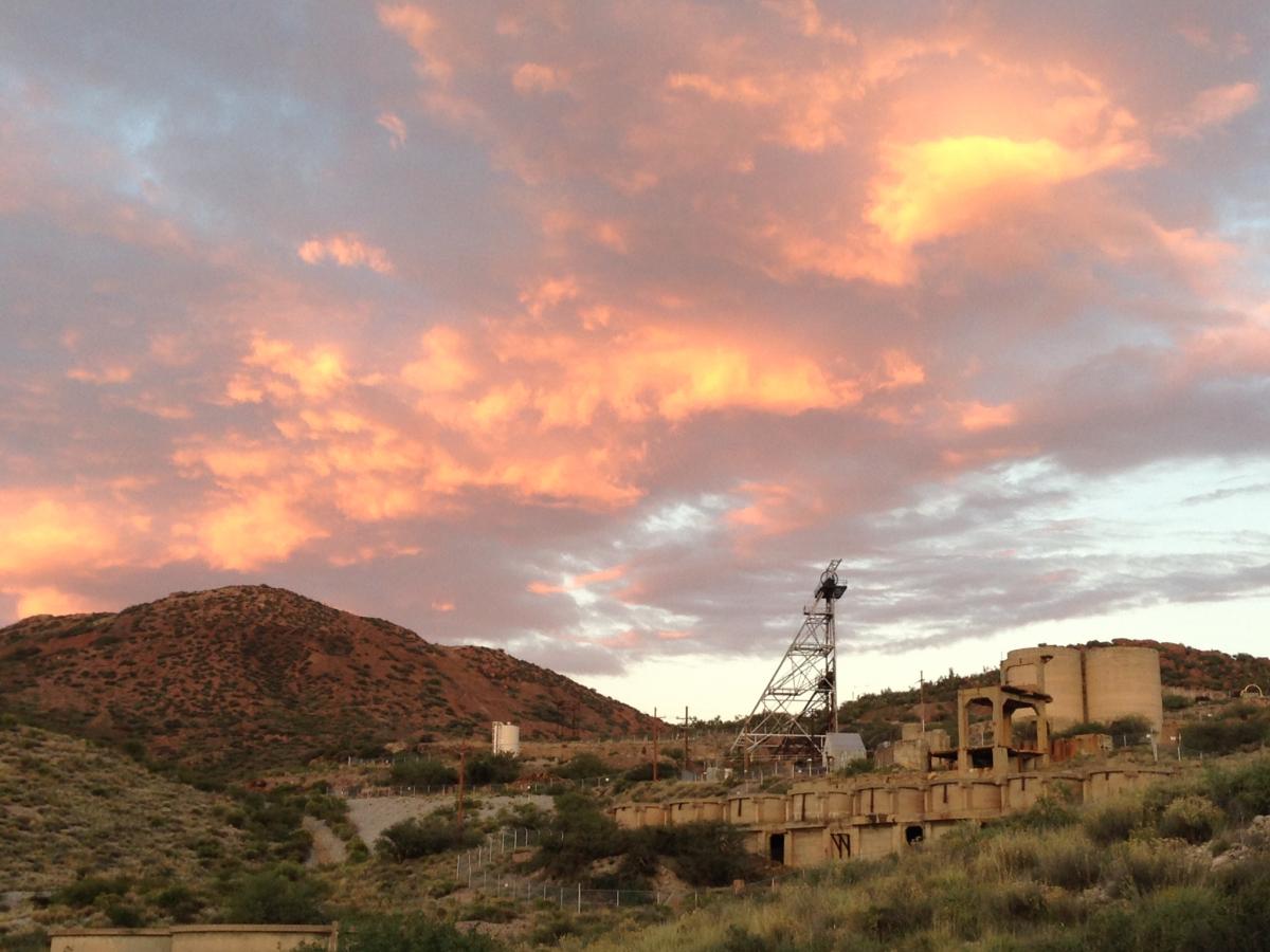 Scenic sunset at deserted mine with crane.