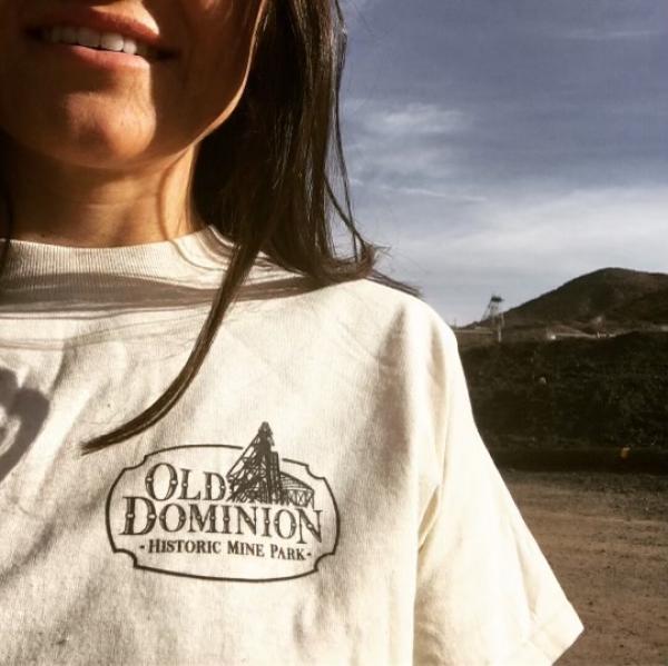 Woman in Old Dominion shirt.