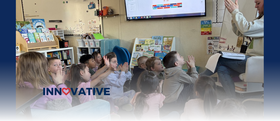 HHES students gather around their teacher for an English lesson.