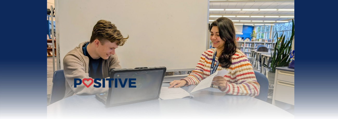 AmeriCorps Student Learning Advocate tutoring a student.