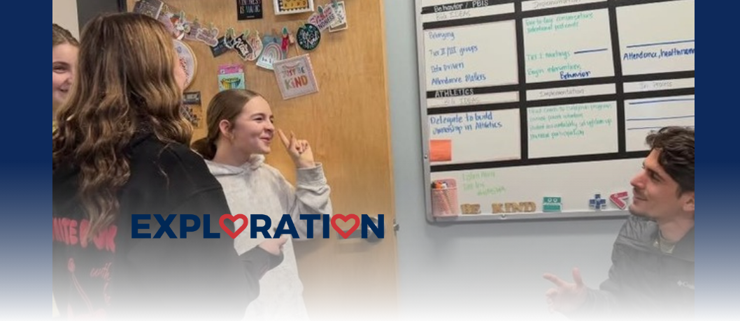 HMS Leadership students talk with Mr. Slom about a fundraiser they planned to host during lunch.