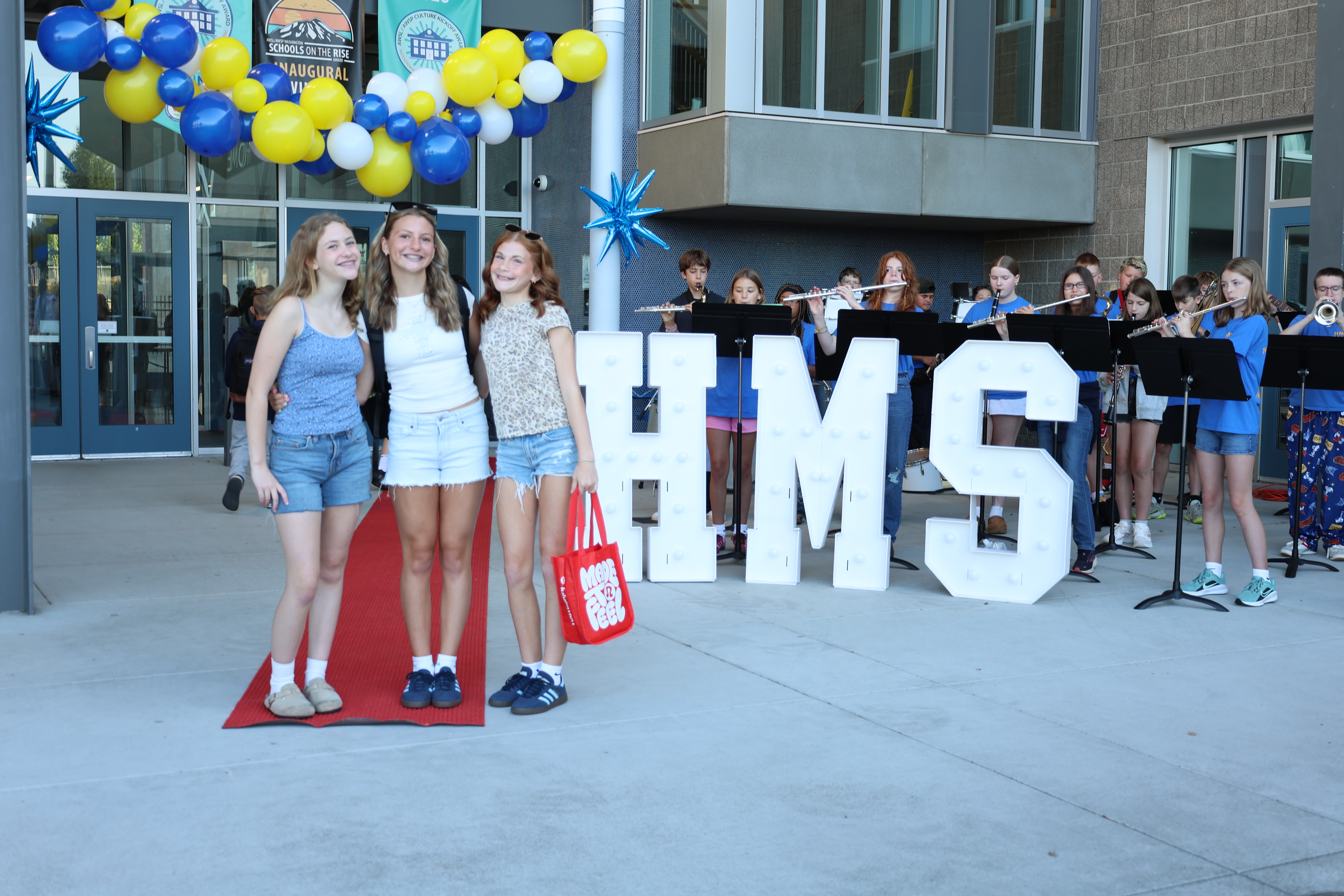 Picture of 3 HMS students on first day of school