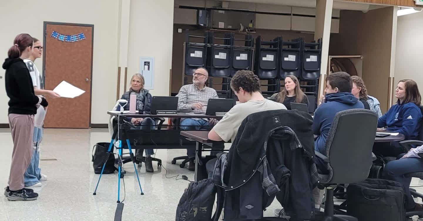 Students present at a school board meeting