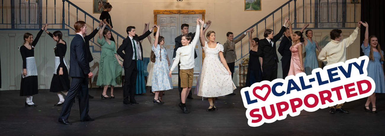 Theater students dance on stage with a stamp overlay that reads "Local Levy Supported"