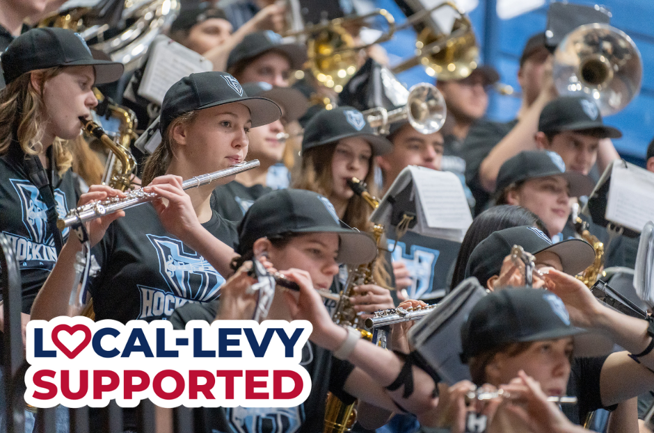 Photo of band students with stamp that reads local-levy supported.