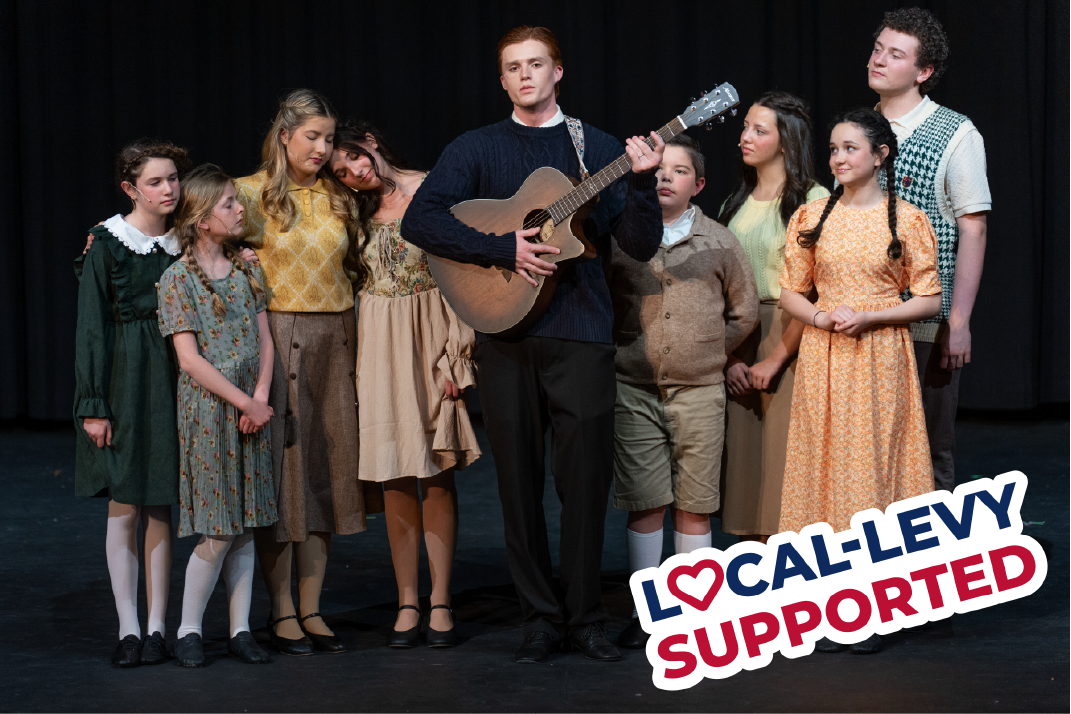 Theatre students in the Sound of Music Production, one with a guitar