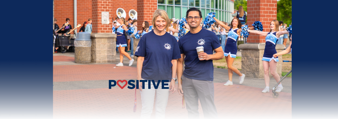 HHS' Tim Fox and Kathy Pacheco welcome students to the first day of the 2025-26 school year.