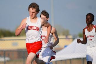 Two runners compete in the boys 3200m run at the Class 3A State Track Meet in Chicago on June 8, 2019.