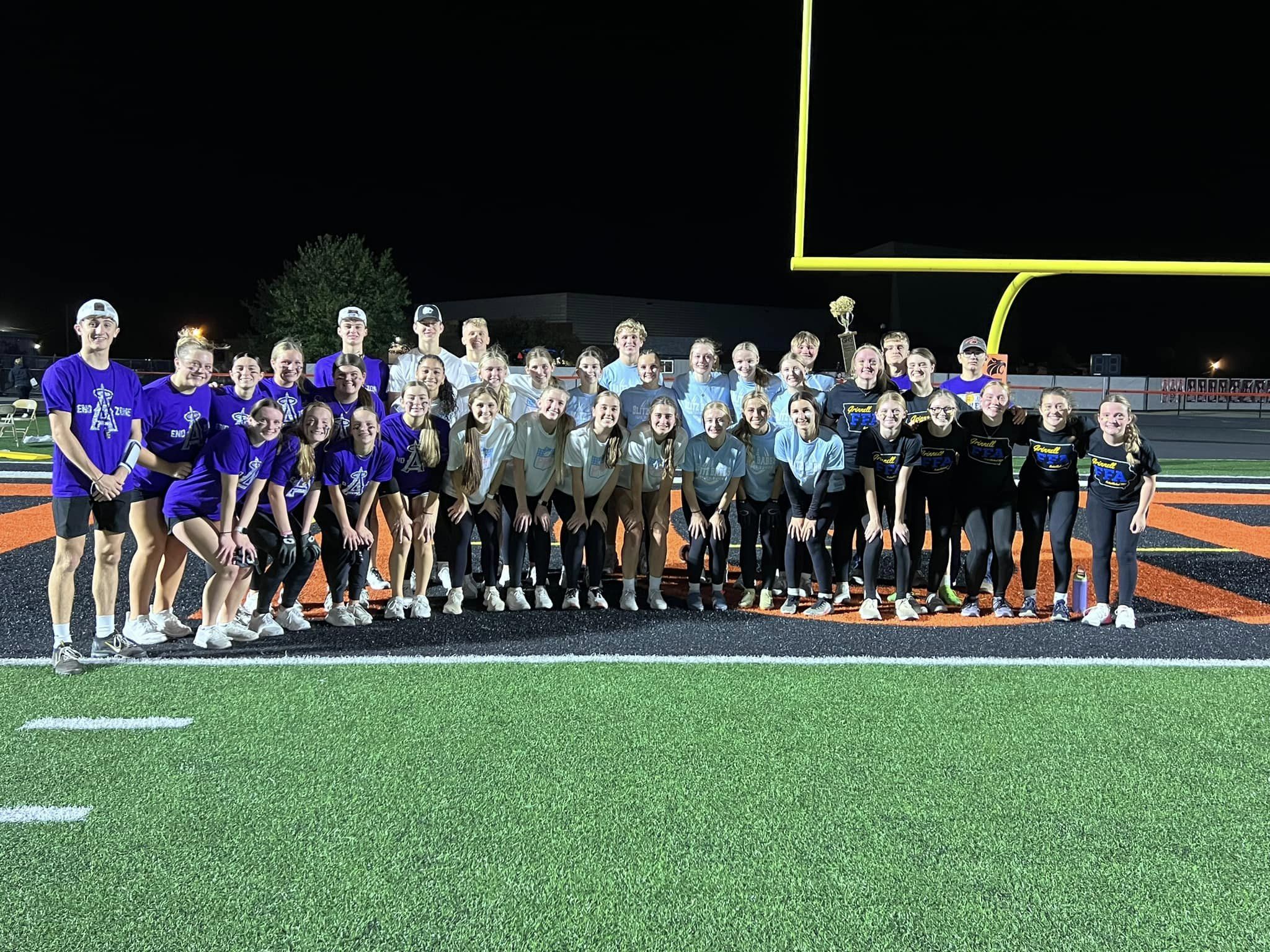 Powder Puff Football game participants on football field