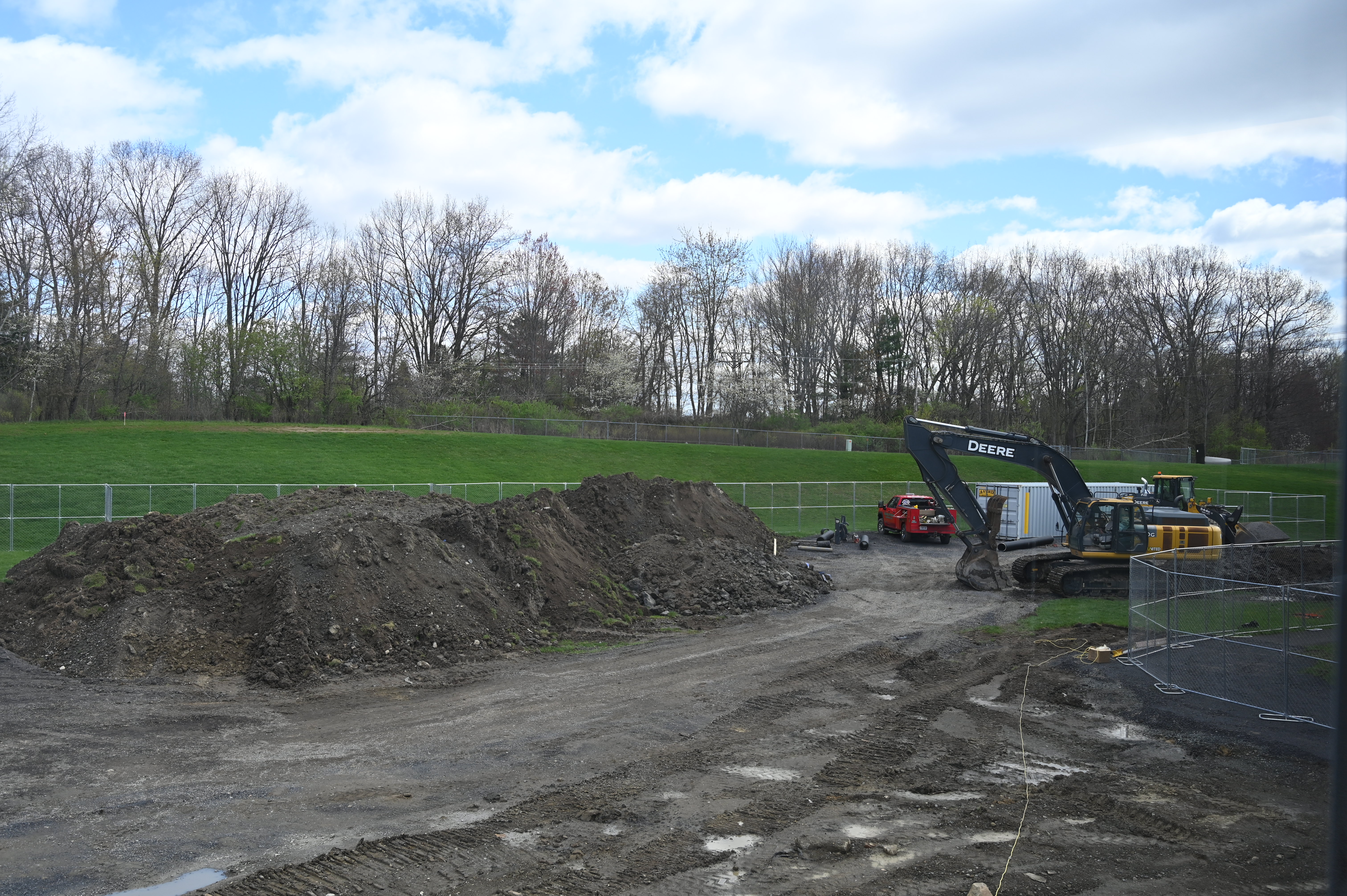 Bulldozers move large amounts of dirt to pave the way for a construction site.