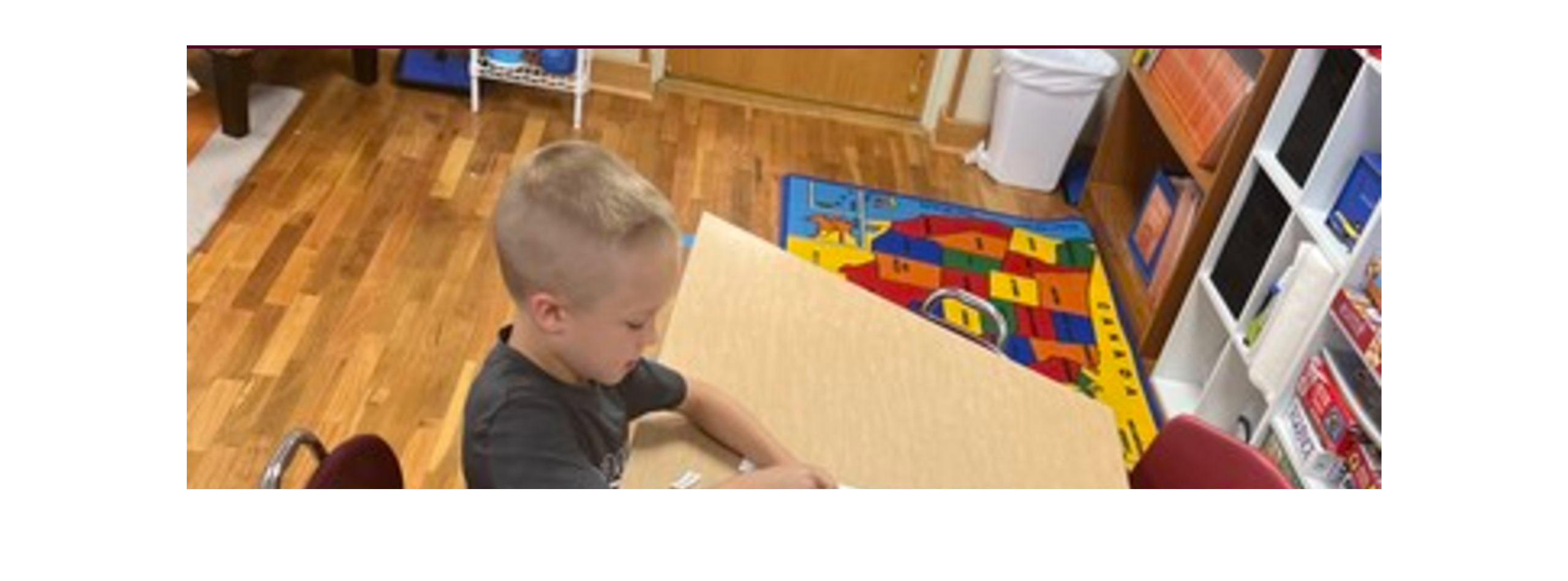 student working on assingment at a school desk