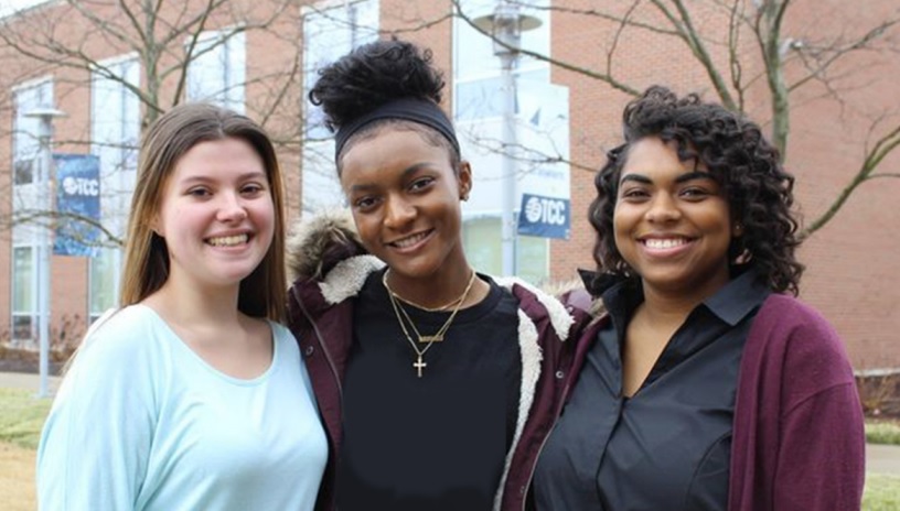 Three smiling young women