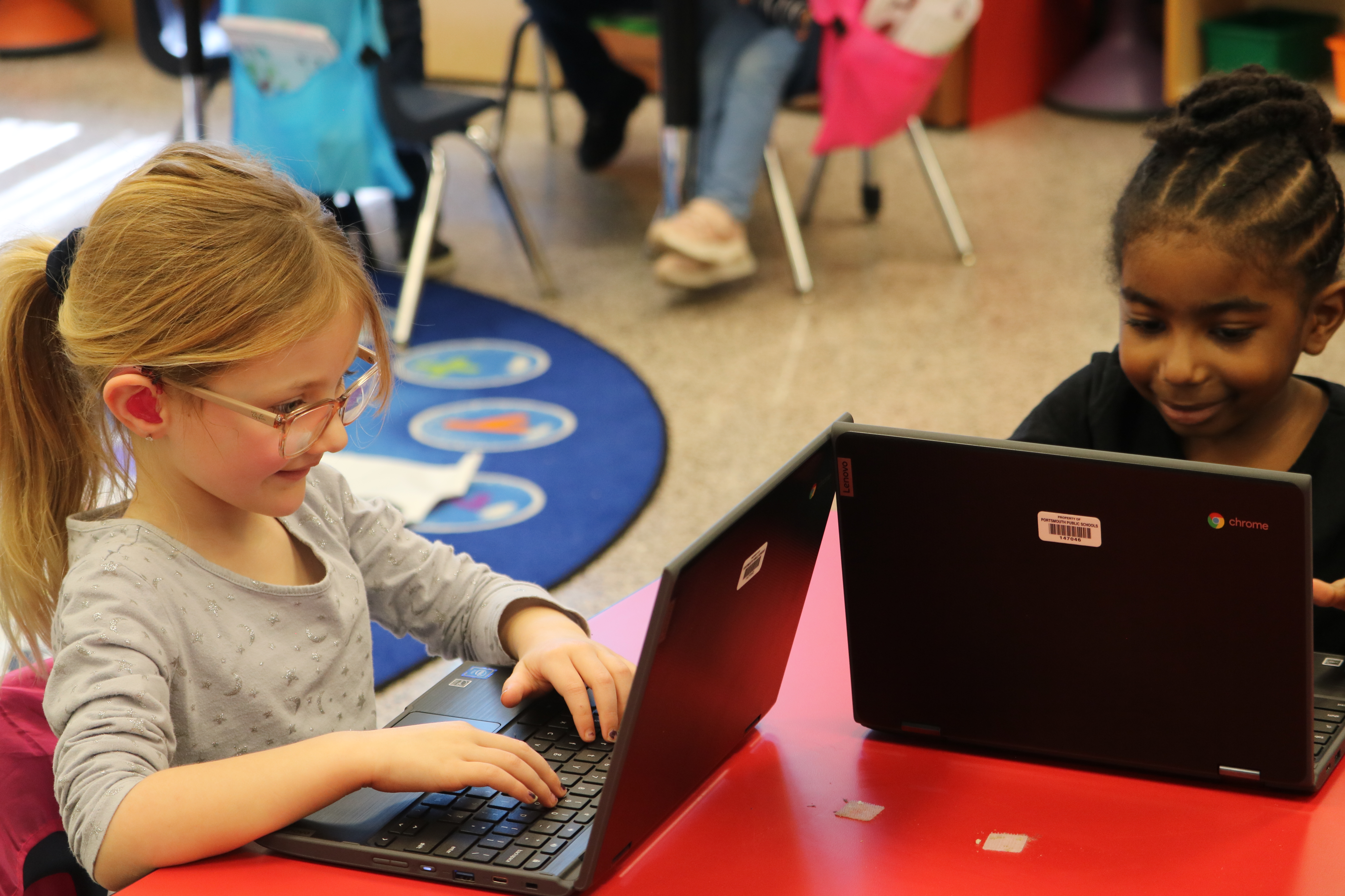 Two students working at a table