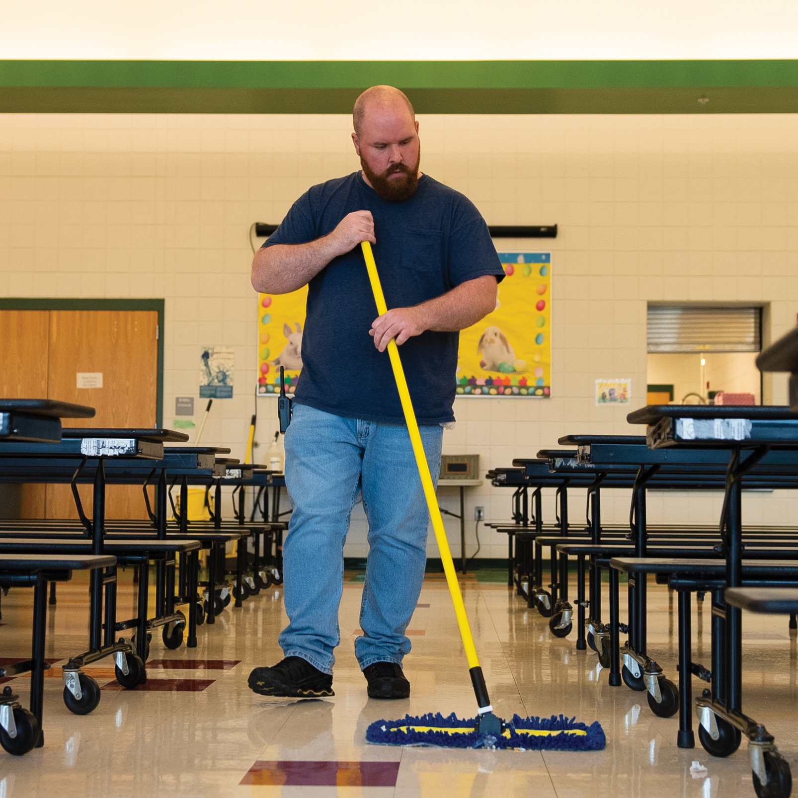 custodian cleaning floors