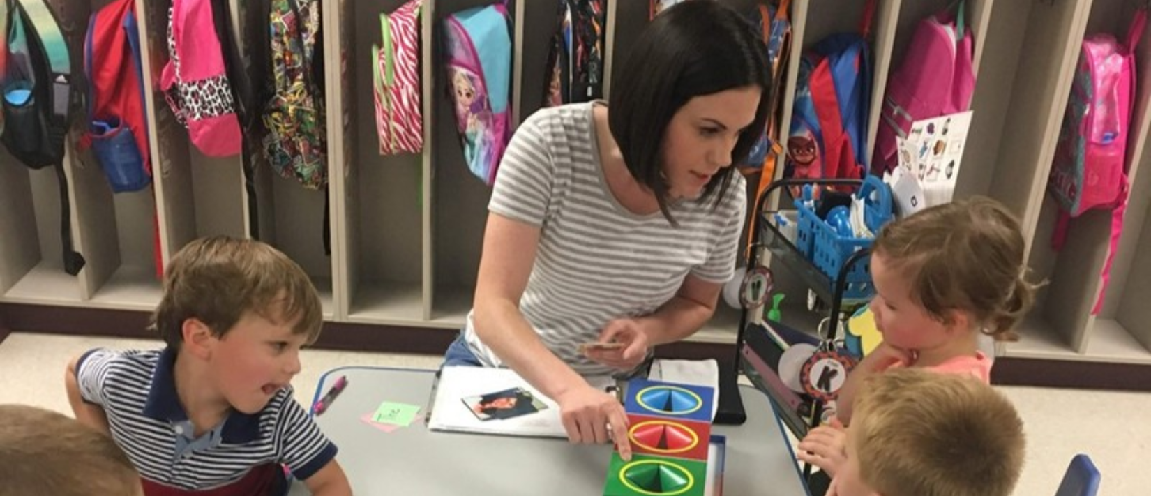 photo of teacher talking to students