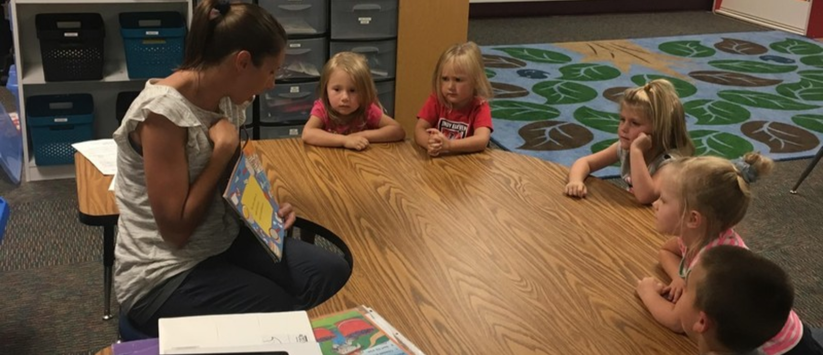 photo of teacher reading to students