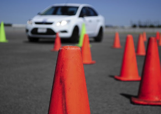 a car on the road with cones