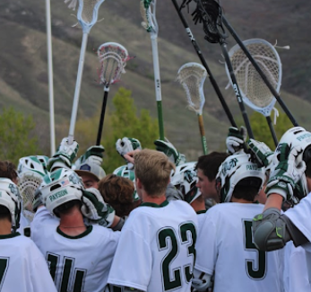 lacrosse team holding their stick