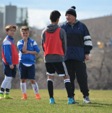 soccer coach with players