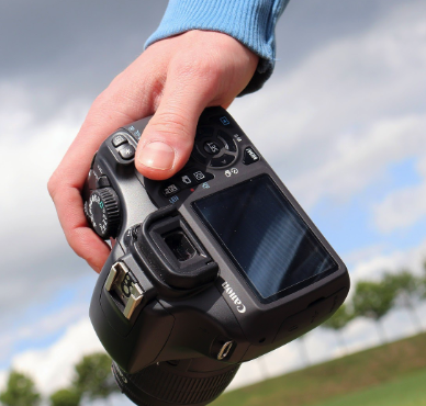 hand holding a camera