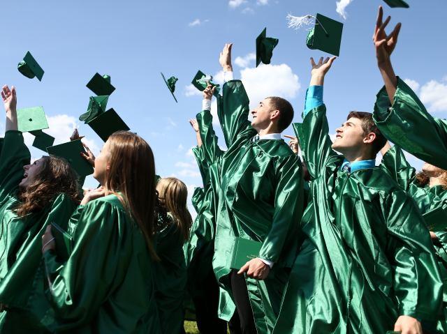 Graduates tossing caps