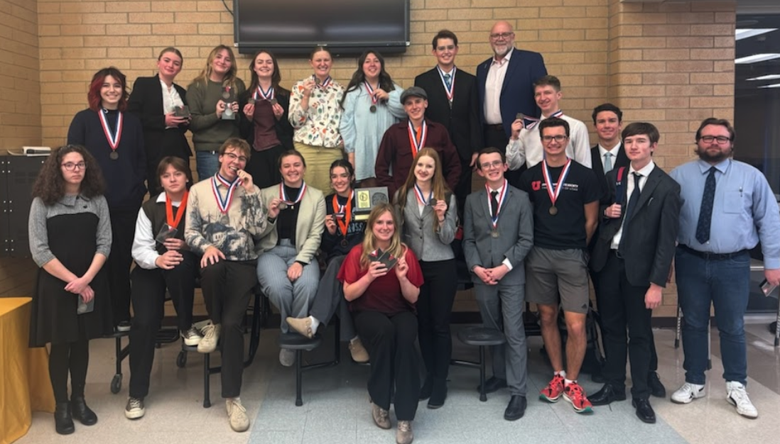 debate team with their medals