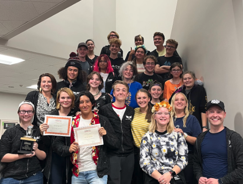 Theatre team holding a diploma