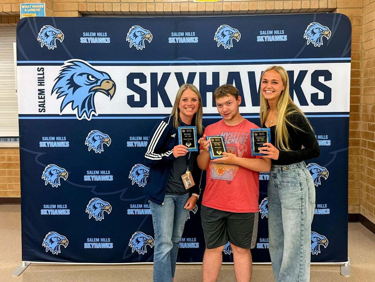 students and coaches getting their award