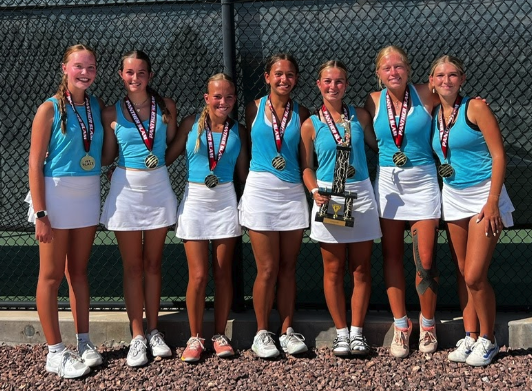 tennis girl team holding a trophy