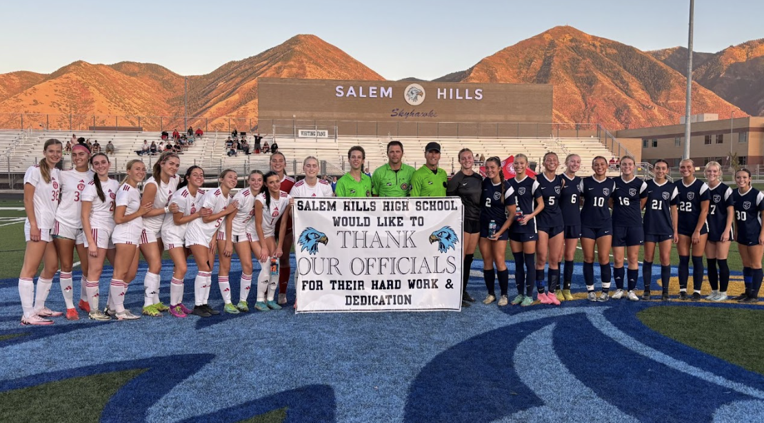 Girls Soccer team with officials thank you