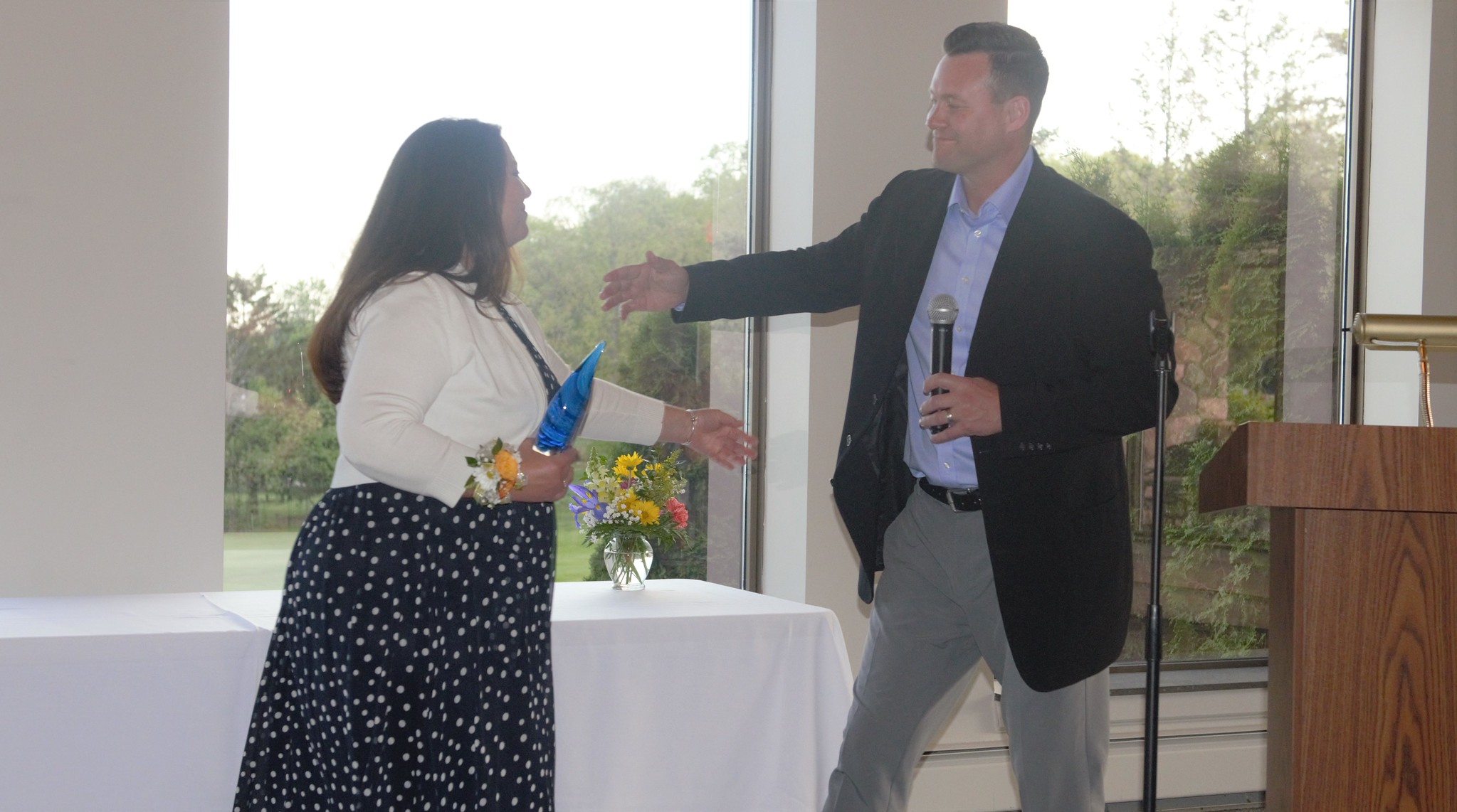 Theresa Roberts accepting an award from LCS Superintendent Matt Wandrie