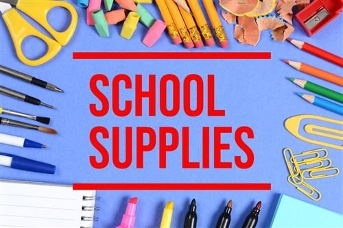 A collection of colorful school supplies arranged neatly on a desk, including notebooks, pencils, and markers for classroom use.